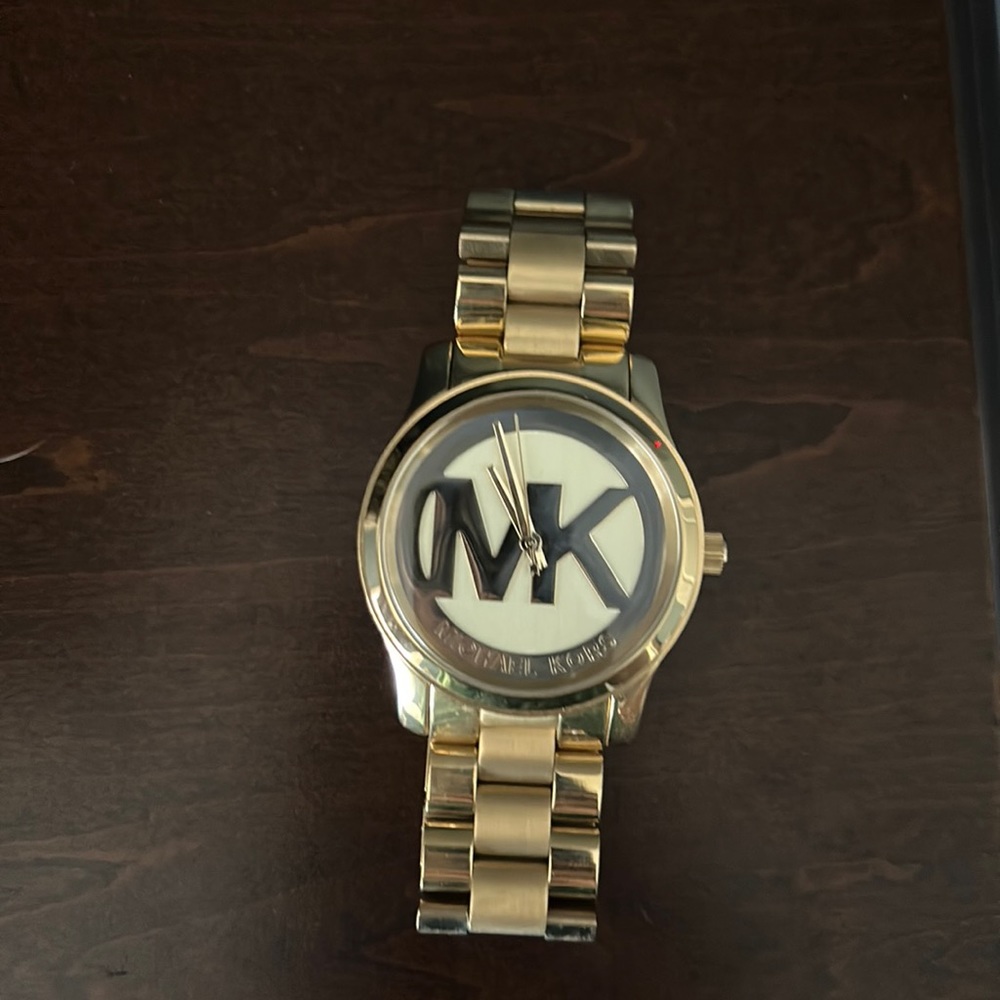 Women’s gold MK watch